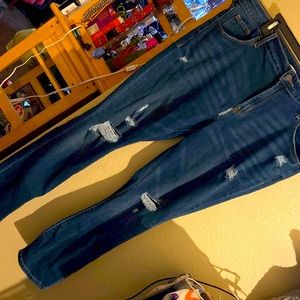 Old navy jeans hole in  zipper area as photographed